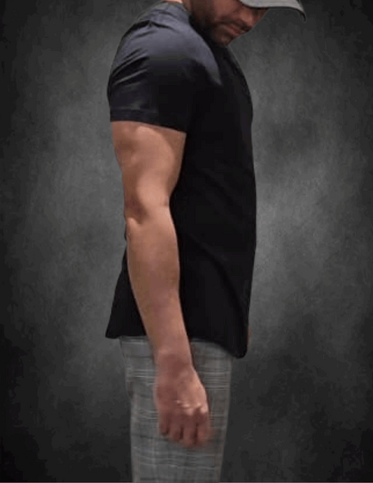 Side view of man wearing the Dron Black t-shirt demonstrating the drape and fit. An Excellent choice for office to gym as it maintains its structure and comfort lasting all day long.