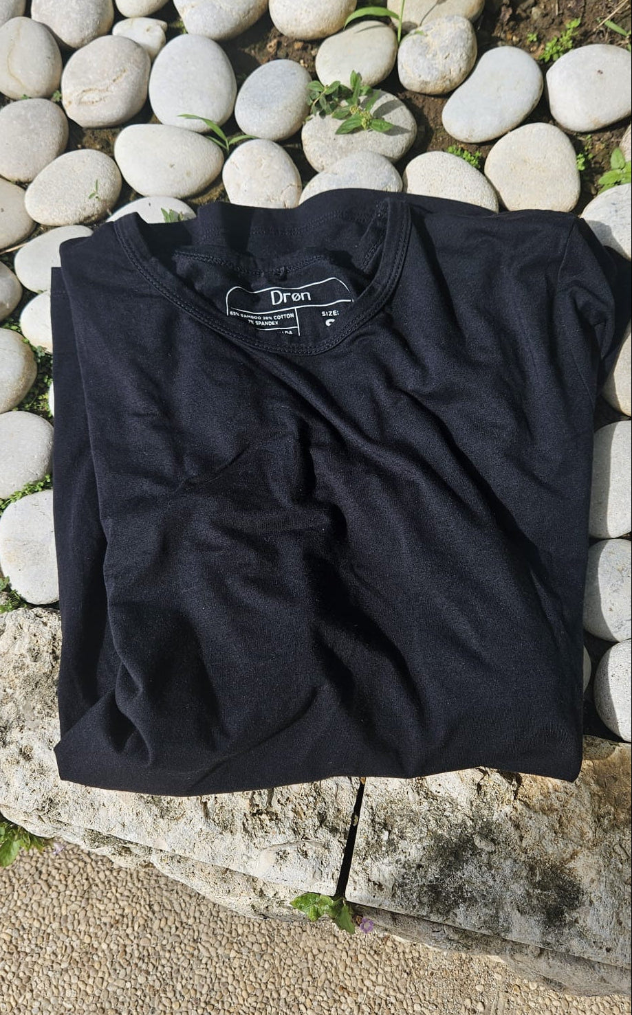 Close up fabric of the Drøn Intent Tee. 93% Natural fabrics Bamboo-Cotton blend.